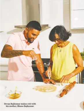  ?? ?? Devan Rajkumar makes roti with
his mother, Bhano Rajkumar.