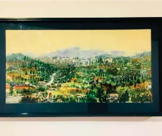  ??  ?? A scene of Baguio City is painted by Claude Tayag