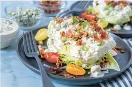  ?? DREAMSTIME ?? This classic wedge salad is embellishe­d with pancetta and cherry tomatoes.
