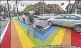  ?? JOHN SPINK /JSPINK@AJC.COM ?? A petition is asking that the crosswalks at 10th Street and Piedmont Avenue in Midtown be painted in the colors of the rainbow or transgende­r flags. In 2015, during the Atlanta Pride event, the crosswalks bore the pride colors.