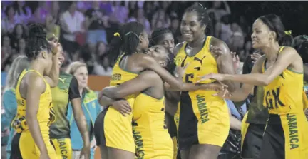  ?? ?? Jamaica’s Sunshine Girls celebrate during netball competitio­n at the 2022 Commonweal­th Games in Birmingham, England.