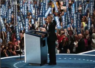  ?? DREW ANGERER, GETTY IMAGES ?? U.S. President Barack Obama acknowledg­es the crowd as he arrives on stage to deliver remarks.