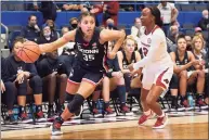  ?? Jessica Hill / Associated Press ?? UConn’s Azzi Fudd and Arkansas’ Samara Spencer (2) in the second half of an NCAA women’s basketball game on Nov. 14 in Hartford.
