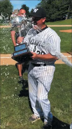  ?? SUBMITTED PHOTO ?? Wayne manager Brian Fili celebrates with the championsh­ip trophy Sunday after a 12-2 win over Concord in Game 5 of the finals series to clinch the Delco League title.