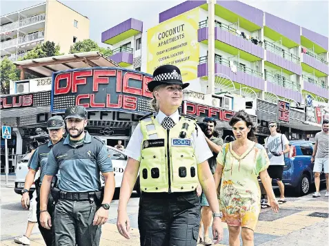  ??  ?? PC Martina Anderson in Magaluf, Majorca. She was one of two British policemen who were sent to help the Guardia Civil deal with drunken and anti-social behaviour in the resort