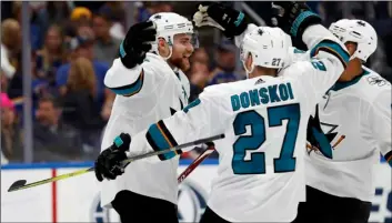  ?? AP PHOTO/JEff ROBERSON ?? San Jose Sharks center Dylan Gambrell (left) celebrates with Joonas Donskoi (27), of Finland, and Evander Kane (9) after Gambrell scored against the St. Louis Blues during the second period in Game 6 of the NHL hockey Stanley Cup Western Conference final series on Tuesday in St. Louis.