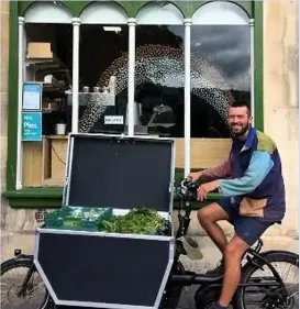  ??  ?? Hamish Evans delivers over 50 fruit and vegetable boxes on his bike