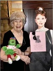  ?? COURTESY OF THE HERITAGE OF GREEN HILLS ?? A resident of The Heritage of Green Hills next to a cutout of Audrey Hepburn in her role in “Breakfast at Tiffany’s” during the Little Black Dress Party.