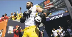  ?? NAM Y. HUH THE ASSOCIATED PRESS ?? Pittsburgh Steelers offensive tackle and former Army Ranger Alejandro Villanueva stands outside the tunnel alone during the national anthem before a game Sunday against the Chicago Bears in Chicago.
