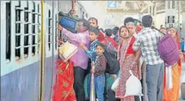  ?? PTI ?? Passengers boarding a train after the services were partially resumed at the railway station in Jammu on Sunday.