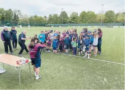  ??  ?? Maidenhead's director of women's rugby Stephen Jones, top left, and the u13s/14s rugby taster session at Braywick Park.