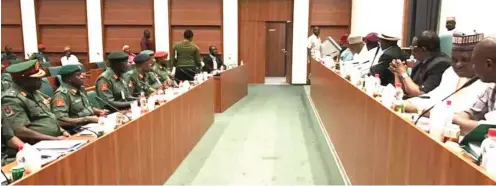  ?? Photo: Army Headquarte­rs ?? Chief of Army Staff, Lt.-Gen. Tukur Y. Buratai (3rd left) and senior army officers, during the Nigeria Army budget defence with members of the House of Reps. Committee on Army at the National Assembly in Abuja yesterday