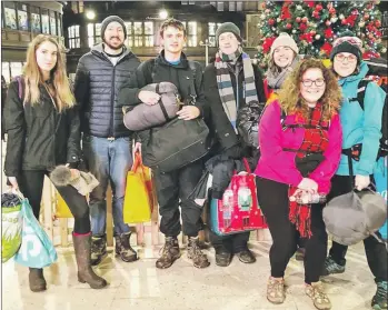  ??  ?? Pupils and teachers from Arran High School at Central Station in Glasgow on their way to the event in Kelvingrov­e Park.