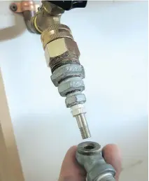  ?? STEVE MAXWELL ?? Fittings like these allow air to be pumped into cottage water systems from a small compressor, making drainage faster and more certain. You can find these at any hardware store.