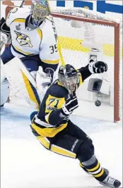  ?? GENE J. PUSKAR/AP ?? Goalie Pekka Rinne and the Predators must contain the Penguins’ Evgeni Malkin, among others, Sunday night.