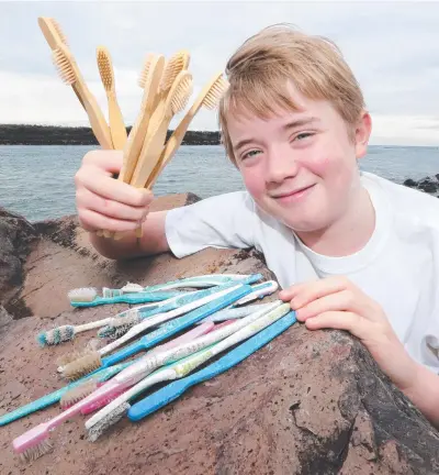  ?? Picture: MIKE BATTERHAM ?? Ned Heaton, 11, has been honoured as the Changemake­r of the Year for his bamboo brushes.