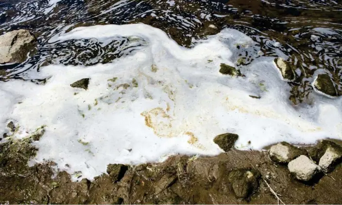  ?? Photograph: Jake May/AP ?? PFAS from firefighti­ng foam at the the Van Etten Creek dam in Oscoda Township, Michigan.