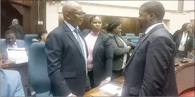  ?? (File pic) ?? Ministry of Health Principal Secretary/Controllin­g Officer Khanya Mabuza (L) in discussion­s with the Auditor General, Timothy Matsebula, after the PAC sitting was adjourned.