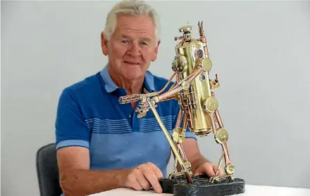  ?? SCOTT HAMMOND/STUFF ?? Colin Everest made the copper and brass robot sculpture out of an old fire extinguish­er.