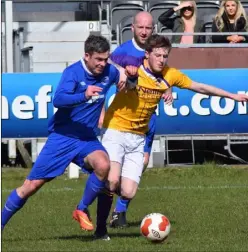  ??  ?? Dean Gibbons of the A.U.L. and Wexford’s John Peare battle for the ball during the FAI Oscar Traynor Trophy quarter-final.