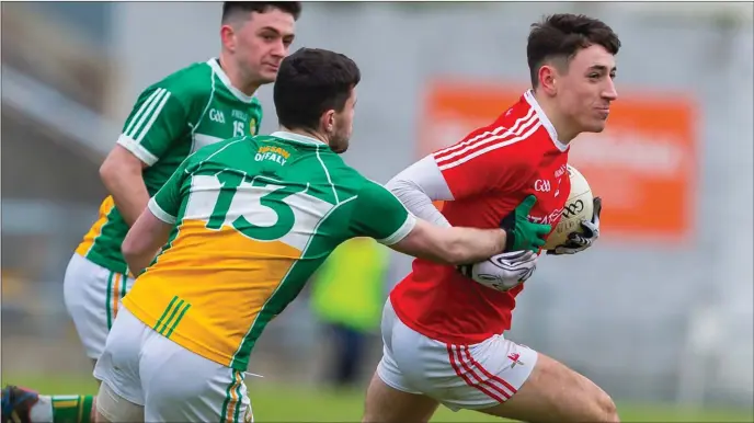  ??  ?? Louth’s Fergal Donohoe breaks away from Bernard Allen and Ruairi McNamee during Sunday’s National League clash in Tullamore.