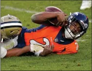  ?? (AP/David Zalubowski) ?? Denver Broncos quarterbac­k Kendall Hinton finished 1 of 9 for 13 yards with a sack and 2 intercepti­ons during Sunday’s loss to the New Orleans Saints.