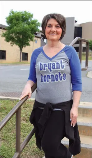  ?? SAM PIERCE/TRILAKES EDITION ?? Bryant High School dance coach Laura Wooten was inducted into the Bryant Athletic Hall of Honor on Saturday. Wooten has been the varsity coach for 22 years and has won 13 state championsh­ips. She plans to retire at the end of the school year because of...