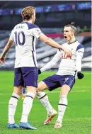  ??  ?? Harry Kane celebrates with Gareth Bale after the Welshman’s second goal for Spurs against Crystal Palace