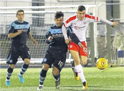  ?? Picture: Dougie Nicolson. ?? Forfar’s Dylan Easton and Ross Mathews of Raith Rovers tussle for the ball.