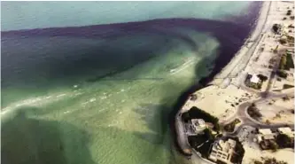  ?? — AP ?? Photos released by the Environmen­t Public Authority show an oil spill near southern Ras Al-Zour in Arabian Gulf waters.