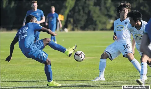  ?? PHOTO: LINDA ROBERTSON ?? Through ball . . . Southern United forward Azariah Soromon executes a pass during a National Football Premiershi­p match at Sunnyvale last night, while Auckland City players Yousif Ali and Takuya Iwata try to intercept it.