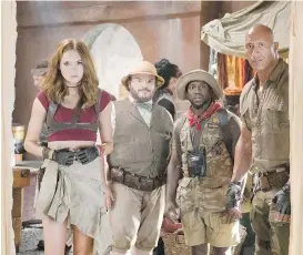  ??  ?? Karen Gillan, left, Jack Black, Kevin Hart and Dwayne Johnson in Jumanji: Welcome to the Jungle.