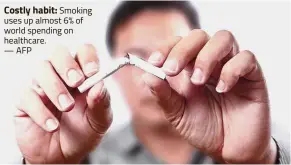  ??  ?? Costly habit:
Smoking uses up almost 6% of world spending on healthcare.
— AFP