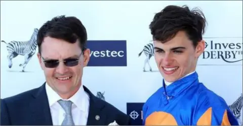  ??  ?? Aidan O’Brien with his son, Donnacha, before the latter switched from riding to training.