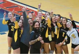  ?? MATT BUTTON/BALTIMORE SUN MEDIA ?? South Carroll players and coaches celebrate after their five-set win over Patterson Mill in the Class 1A state semifinal Monday at Thomas Johnson High in Frederick.