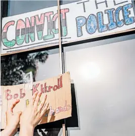  ?? BRANDON BELL/GETTY ?? A sign is posted on a window of the 2nd Precinct police station in Minneapoli­s at demonstrat­ion Thursday. Protesters called for Lt. Bob Kroll, head of the police union, to be fired.