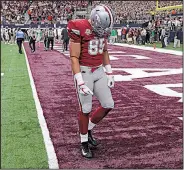  ?? Arkansas Democrat-Gazette/BENJAMIN KRAIN ?? Arkansas tight end Cheyenne O’Grady leaves the field Saturday after the Razorbacks’ overtime loss at AT&T Stadium in Arlington, Texas.