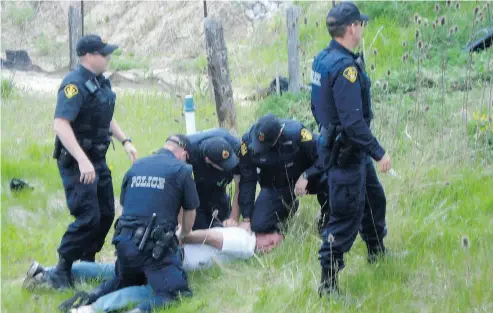  ?? SUPPLIED ?? Randy Fleming had jumped off a road to the ditch and then onto the adjacent land – native- occupied, and thus sacred, land — in order to avoid the OPP cars rushing toward him on May 24, 2009, Christie Blatchford writes.
