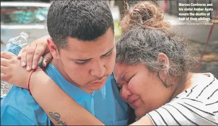 ?? SCOTT OLSON/GETTY IMAGES ?? Marcos Contreras and his sister Amber Ayala mourn the deaths of four of their siblings.