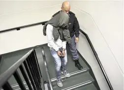  ?? PICTURE: NOOR SLAMDIEN/AFRICAN NEWS AGENCY (ANA) ?? GOING DOWN: Odwa Nkololo is escorted out of court after being convicted of rape and murder.