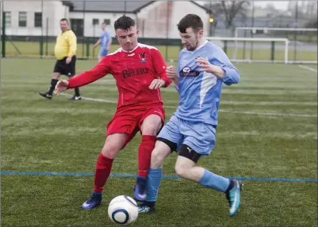  ??  ?? Mark Hughes and Gavin Gardiner in action. Pics: Donal Hackett.