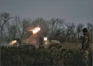  ?? (AP/LIBKOS) ?? A Ukrainian military Grad multiple rocket launcher fires rockets at Russian positions Thursday in the frontline near Bakhmut, Donetsk region, Ukraine.