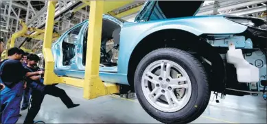  ?? PROVIDED TO CHINA DAILY ?? Workers check cars at Brilliance Auto’s production line in Shenyang, Liaoning province.