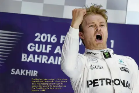  ?? — AFP ?? This file photo taken on April 3, 2016, shows Mercedes AMG Petronas F1 Team’s German driver Nico Rosberg celebratin­g on the podium after winning the Bahrain Formula One Grand Prix at the Sakhir circuit in Manama.