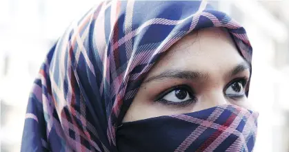  ?? THE CANADIAN PRESS ?? Zunera Ishaq, who wore the niqab while taking her Canadian citizenshi­p oath, believes women are “unclean” when menstruati­ng, a view shared by some Orthodox Christians, Jews and Hindus. So, Stephen Hume asks, is it an anti-Canadian value?