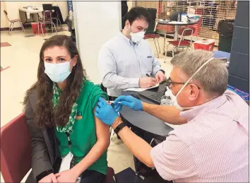  ??  ?? The Monroe school district hosted a COVID-19 vaccine clinic for staff Wednesday at Masuk High School.