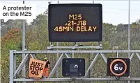  ?? ?? A protester on the M25