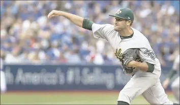  ?? FRED THORNHILL – THE CANADIAN PRESS VIA AP ?? A’s starting pitcher Chris Smith allowed three runs in six innings in Monday’s 4-2loss to Toronto.