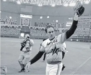  ?? TIM JOHNSON THE ASSOCIATED PRESS FILE PHOTO ?? In this Sept. 26, 1981, photo, Astros’ Nolan Ryan waves to the crowd after pitching his fifth career no-hitter, defeating the Los Angeles Dodgers, 5-0, in Houston.