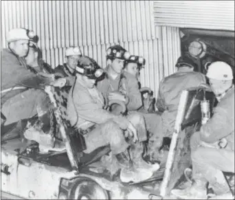  ?? FILE — THE ASSOCIATED PRESS ?? In this file photo, one of two seven-man rescue teams enters the Consolidat­ion Coal mines in Farmington, W.Va., where 78 miners have been trapped. It’s been nearly half a century since 78 men perished in the Farmington No. 9 mine disaster in West...